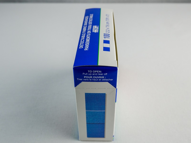 Santinel - Boîte de 100 Pansements adhésifs en tissu bleu pour doigt - vue de côté